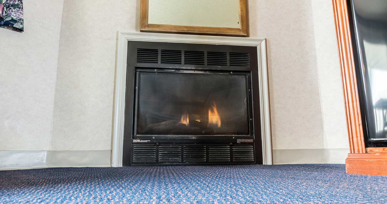 a-fireplace-in-a-pigeon-forge-hotel-room-twin-mountain-inn