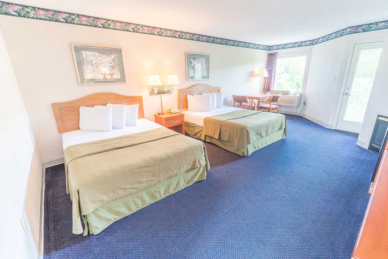 Two Queen beds in a hotel suite in Pigeon TN Twin Mountain Inn